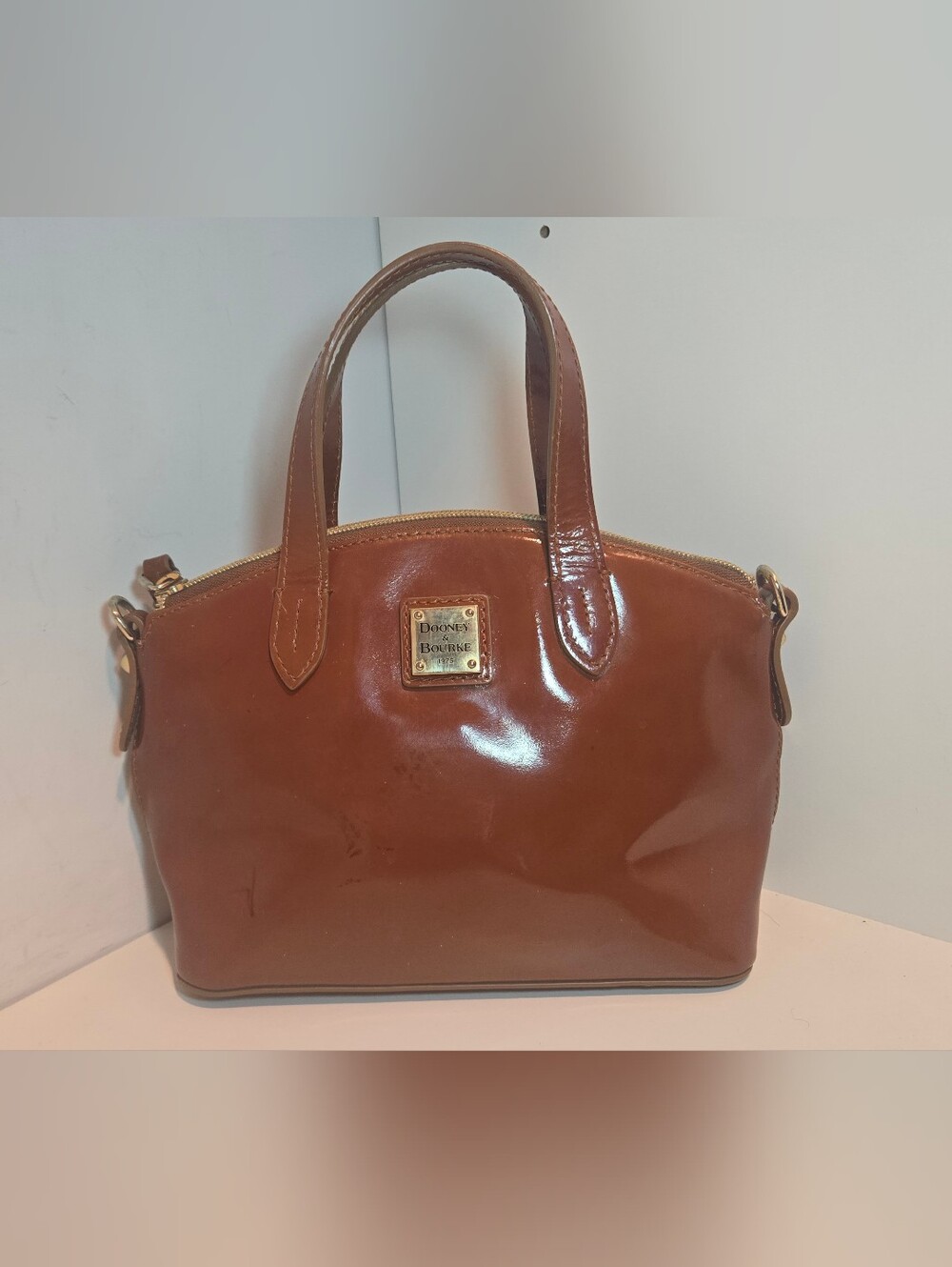 Dooney & Bourke Cognac Patent Leather Satchel with Gold Plaque